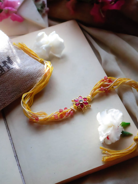 Sukhi Kundan Floral Yellow Rakhi