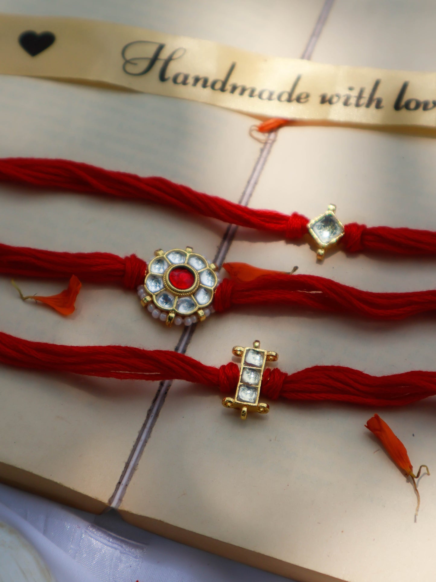 Arihan Red Kundan Rakhi - Set of 3