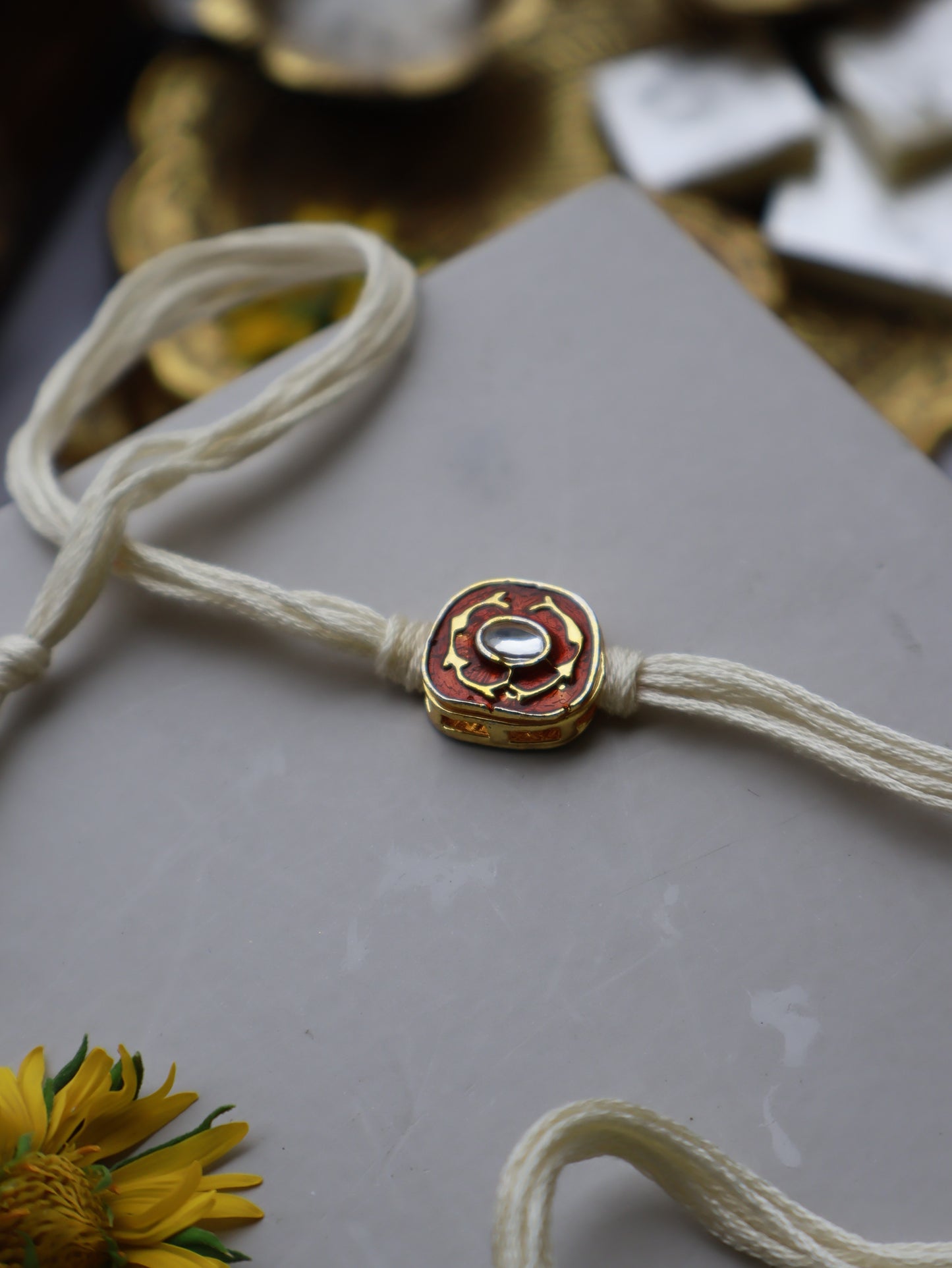 Shwet Orange Kundan Rakhi